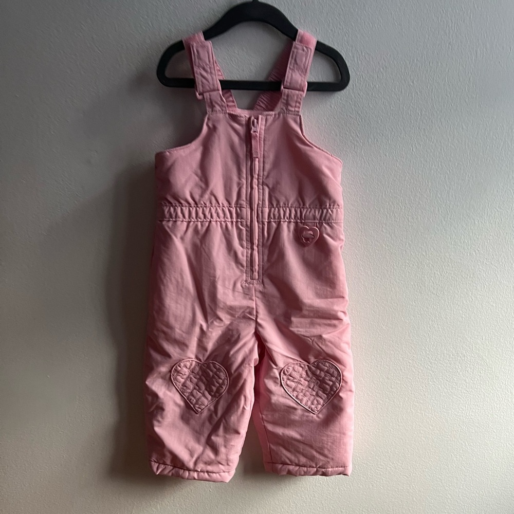 Baby pink snow bib with heart patch on knees 24m